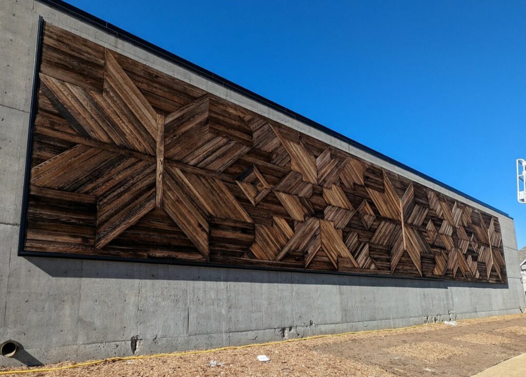 The Morrison mural on a wall outside the center.